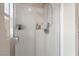 Clean shower with glass enclosure and built-in shelves at 7455 Snowy Owl St # 102, North Las Vegas, NV 89084