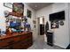 Bright bedroom with dresser, mirror, and access to another room at 7455 Snowy Owl St # 102, North Las Vegas, NV 89084