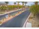 Gated community entrance with landscaped medians and signage at 7455 Snowy Owl St # 102, North Las Vegas, NV 89084