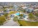 Community pool with surrounding landscaping and seating at 7455 Snowy Owl St # 102, North Las Vegas, NV 89084