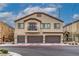 Two-story townhome with three-car garage and balcony at 7455 Snowy Owl St # 102, North Las Vegas, NV 89084