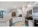 Modern kitchen with stainless steel appliances and granite countertops at 7455 Snowy Owl St # 102, North Las Vegas, NV 89084