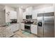 Modern kitchen with stainless steel appliances and white cabinets at 7455 Snowy Owl St # 102, North Las Vegas, NV 89084