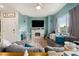 Cozy living room featuring a fireplace and comfortable seating at 7455 Snowy Owl St # 102, North Las Vegas, NV 89084
