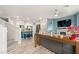 Open living room featuring a modern fireplace and comfortable sectional sofa at 7455 Snowy Owl St # 102, North Las Vegas, NV 89084