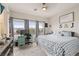 Spacious main bedroom with large windows and en-suite bathroom at 7455 Snowy Owl St # 102, North Las Vegas, NV 89084