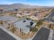 Aerial view of a home with solar panels, showcasing its prime location in a vibrant community at 7520 Darian Jane St, Las Vegas, NV 89149