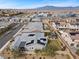 Aerial view of a neighborhood, showcasing modern homes with solar panels and landscaped yards at 7520 Darian Jane St, Las Vegas, NV 89149