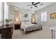 Cozy bedroom featuring an accent wall, metal bed frame, and neutral décor at 7520 Darian Jane St, Las Vegas, NV 89149