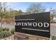 Ravenwood community sign with lush landscaping and stone base at 7520 Darian Jane St, Las Vegas, NV 89149