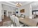 Elegant dining room with stylish chandelier, and neutral decor, ideal for entertaining guests and Gathering gatherings at 7520 Darian Jane St, Las Vegas, NV 89149