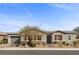 Charming single-story home boasts manicured landscaping, warm lighting, and a welcoming entrance at 7520 Darian Jane St, Las Vegas, NV 89149