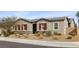 Charming single-story home with desert landscaping, red shutters, and stone accents at 7520 Darian Jane St, Las Vegas, NV 89149