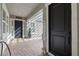 Inviting front porch with stone pavers, a covered entryway, and a 'Welcome' sign, adding charm and curb appeal at 7520 Darian Jane St, Las Vegas, NV 89149