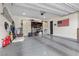 Spacious garage with storage cabinets, epoxy flooring, and an American flag at 7520 Darian Jane St, Las Vegas, NV 89149