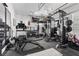 Fully-equipped home gym with a variety of exercise machines and weights at 7520 Darian Jane St, Las Vegas, NV 89149