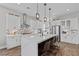 Bright, open kitchen with white cabinets, stainless steel appliances, and a spacious island at 7520 Darian Jane St, Las Vegas, NV 89149