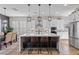 Modern kitchen featuring white cabinetry, stainless steel appliances, and a large center island at 7520 Darian Jane St, Las Vegas, NV 89149
