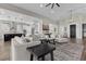 Spacious living room with open layout, modern decor, fireplace and seamless flow into the kitchen at 7520 Darian Jane St, Las Vegas, NV 89149