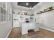 Bright home office featuring custom built-ins, ample storage, a modern desk, and natural light at 7520 Darian Jane St, Las Vegas, NV 89149