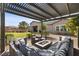 Cozy outdoor patio with comfortable seating and a fire pit at 7520 Darian Jane St, Las Vegas, NV 89149