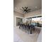 Covered patio with a ceiling fan and an outdoor dining set for entertaining at 7520 Darian Jane St, Las Vegas, NV 89149