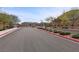 Gated community entrance with lush landscaping and a secure access point at 7520 Darian Jane St, Las Vegas, NV 89149