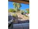 Landscaped backyard with gravel pathway, rock features, and a grill at 85 Day Trade St # 2, Henderson, NV 89074