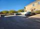 Parking lot with two cars parked in front of a building at 85 Day Trade St # 2, Henderson, NV 89074