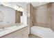 Bathroom with double vanity, bathtub, and shower at 8725 W Flamingo Rd # 110, Las Vegas, NV 89147