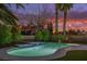 Peaceful illuminated pool and spa at sunset at 911 Pescados Dr, Las Vegas, NV 89123