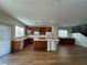 Open concept kitchen with island and hardwood floors at 9217 Placer Bullion Ave, Las Vegas, NV 89178