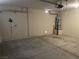 Garage with overhead storage and water heater at 9540 Birch Basin Ct, Las Vegas, NV 89148