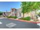 Attractive condo exterior showing stone accents, balcony, and landscaping at 9901 Trailwood Dr # 2007, Las Vegas, NV 89134