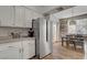 Well-equipped kitchen features stainless steel appliances and white cabinets at 9901 Trailwood Dr # 2007, Las Vegas, NV 89134