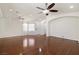 Large living room featuring hardwood floors, ceiling fans and recessed lights at 1069 Appleblossom Time Ave, North Las Vegas, NV 89031
