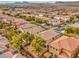 Aerial view of house and neighborhood with mountain views at 10960 Prairie Grove Rd, Las Vegas, NV 89179