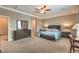 Spacious main bedroom with carpeted floors and large windows at 10960 Prairie Grove Rd, Las Vegas, NV 89179