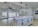 Modern kitchen island with white cabinets and quartz countertop at 1203 Tamerack Ave, Las Vegas, NV 89106