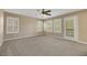 Bedroom with carpet flooring, plantation shutters, and ceiling fan at 1551 Boundary Peak Way, Las Vegas, NV 89135