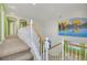 Elegant staircase with mural in the landing area at 1551 Boundary Peak Way, Las Vegas, NV 89135