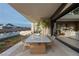 Outdoor dining space with a view of the pool and surrounding landscape at 164 Still Shores St, Henderson, NV 89011