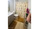 Bathroom with gray vanity, shower, and tiled floor at 1825 Ann Greta Dr, Las Vegas, NV 89108