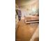 Main bedroom with tiled floor, a queen-size bed, and sliding glass doors at 1825 Ann Greta Dr, Las Vegas, NV 89108