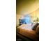 Spacious bedroom with a large bed and sliding glass door access to backyard at 1825 Ann Greta Dr, Las Vegas, NV 89108