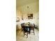 Dining area with a square wooden table and four chairs at 1825 Ann Greta Dr, Las Vegas, NV 89108