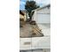 Side of house with a white garage and landscaping at 1825 Ann Greta Dr, Las Vegas, NV 89108