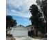 House exterior with palm trees and a fence at 1825 Ann Greta Dr, Las Vegas, NV 89108