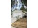 Front of house with a white garage and landscaping at 1825 Ann Greta Dr, Las Vegas, NV 89108