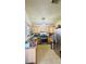 Bright kitchen with wood cabinets, stainless steel appliances, and tile floor at 1825 Ann Greta Dr, Las Vegas, NV 89108